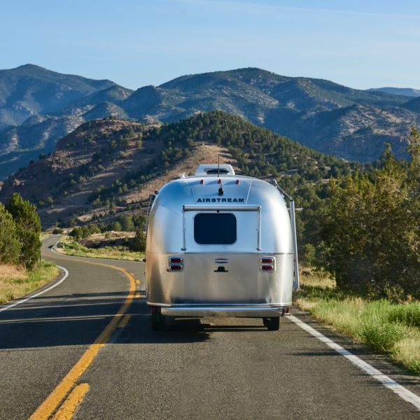 Airstream trailer driving on highw